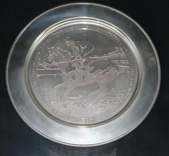 A framed silver commemorative dish relating to Pawneese Champion Racehorse, 1976, by Stuart Devlin